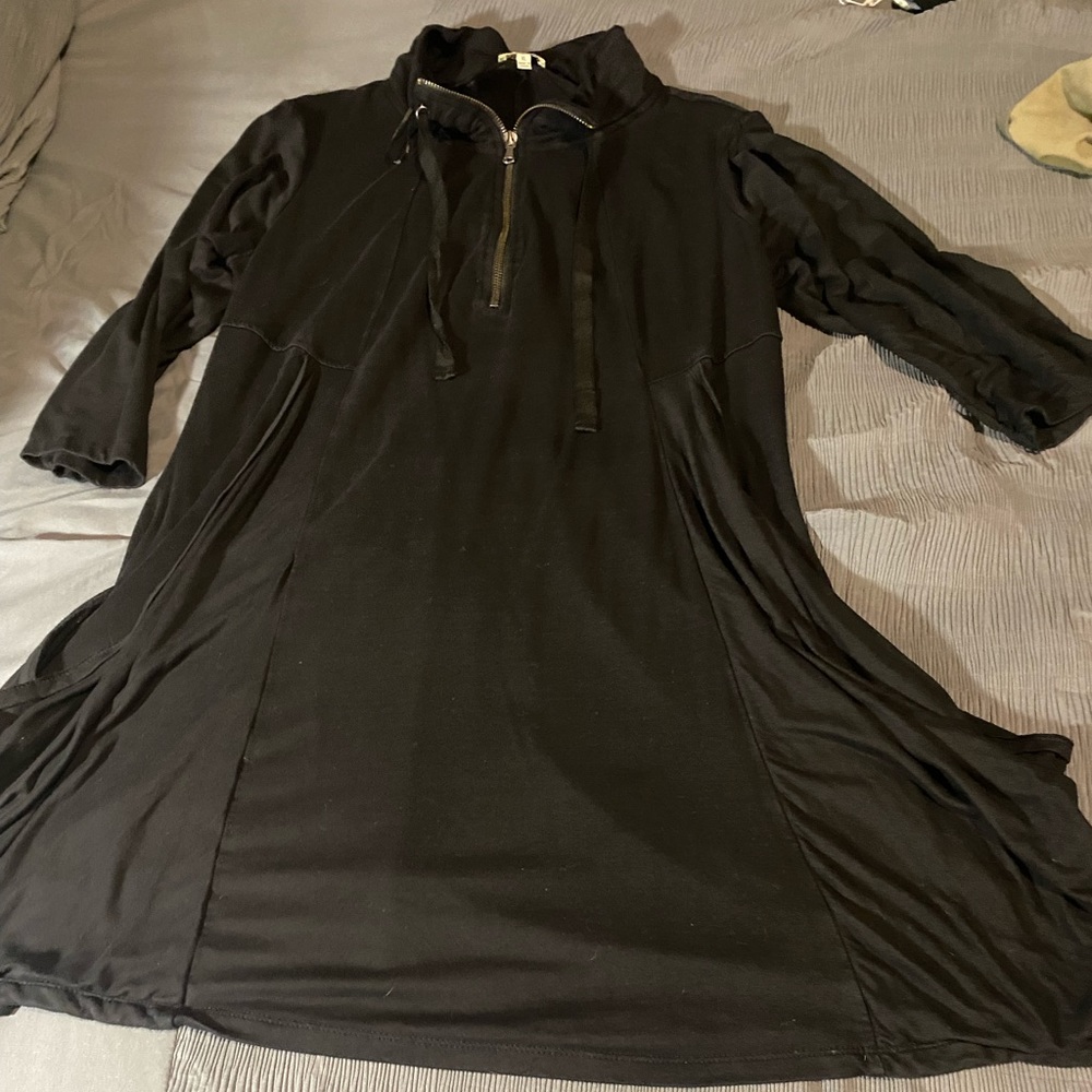Fun, black dress with deep pockets and front half zipper detail.